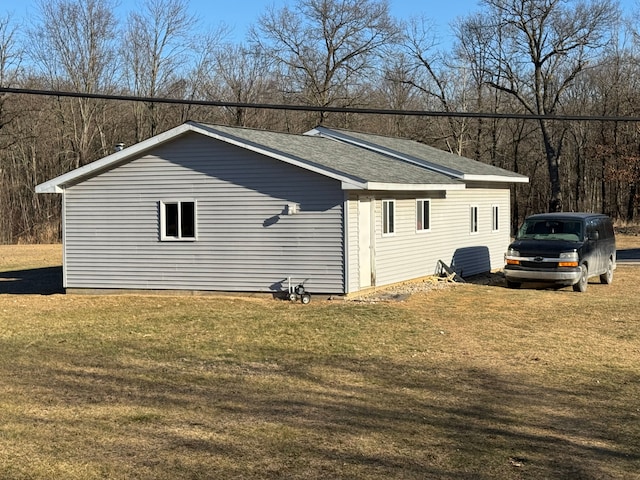 view of property exterior featuring a yard