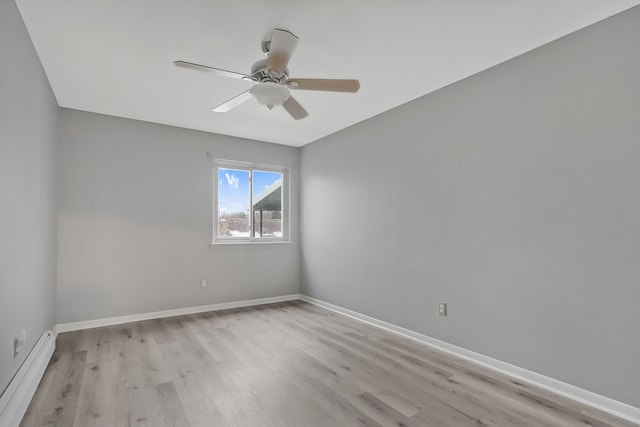 unfurnished room featuring ceiling fan, light hardwood / wood-style flooring, and a baseboard radiator