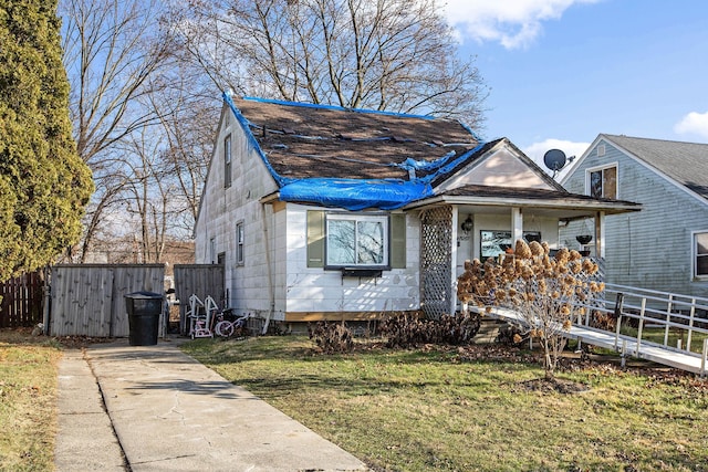 bungalow-style house with a front lawn