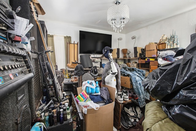 miscellaneous room featuring an inviting chandelier