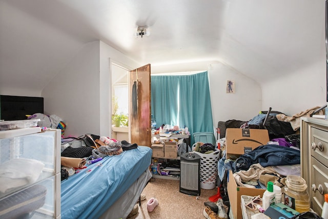 carpeted bedroom featuring lofted ceiling