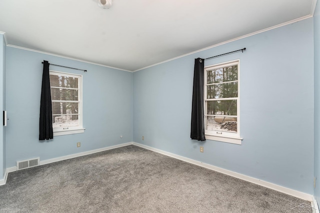 carpeted spare room with ornamental molding