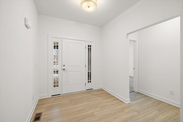 entrance foyer featuring light hardwood / wood-style floors