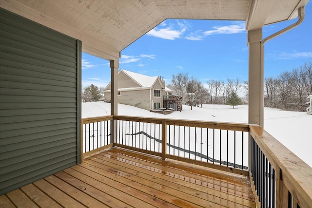 view of snow covered deck