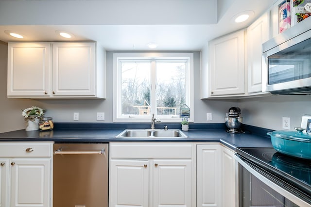 kitchen with white cabinets, sink, and stainless steel appliances