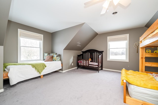 bedroom with carpet flooring, ceiling fan, and vaulted ceiling