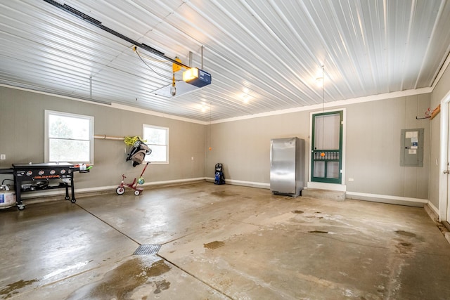 garage featuring stainless steel fridge, a garage door opener, and electric panel