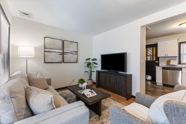 living room featuring dark wood-type flooring