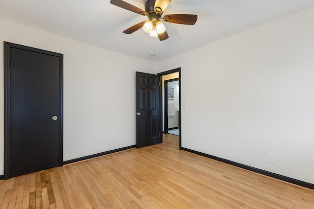 unfurnished room featuring ceiling fan and light wood-type flooring