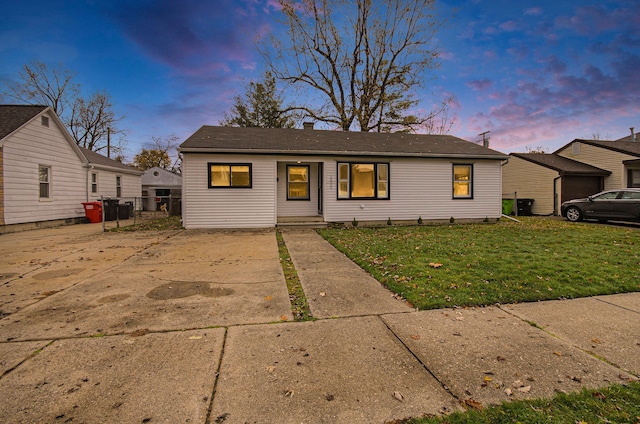 view of front of home with a lawn