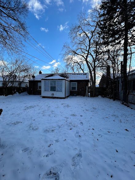 view of snow covered house