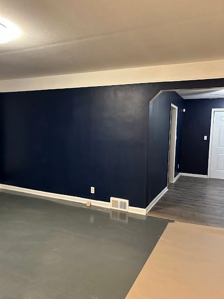 spare room featuring concrete floors