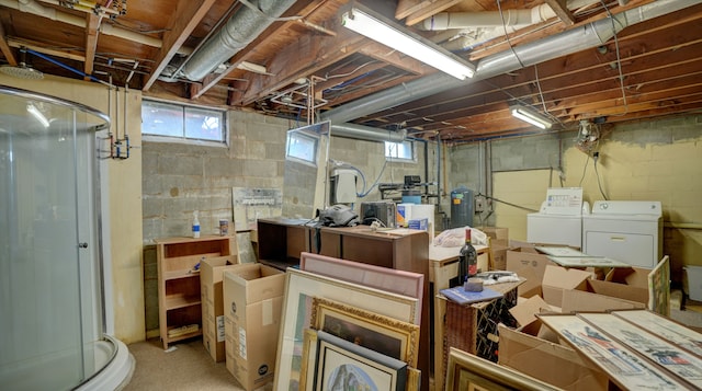 basement with washer and dryer and a healthy amount of sunlight