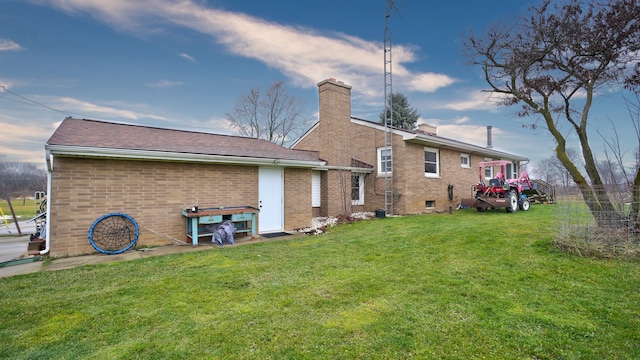 back of house with a yard