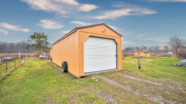 view of outbuilding featuring a yard and a garage