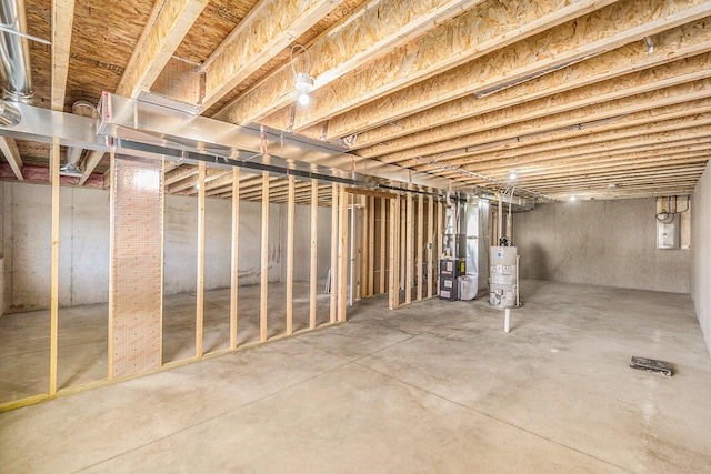 basement with gas water heater and heating unit