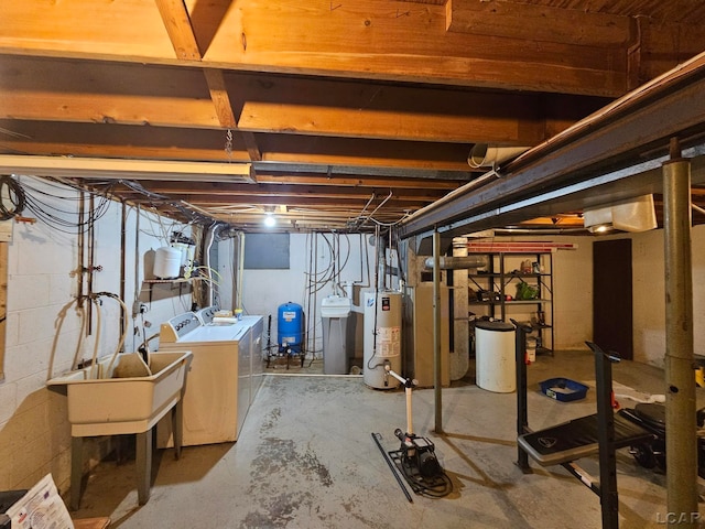 basement featuring washer and dryer and water heater