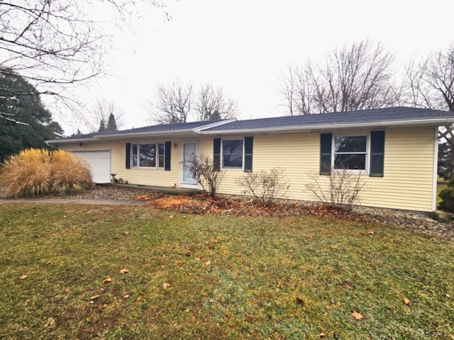 ranch-style house with a garage and a front yard