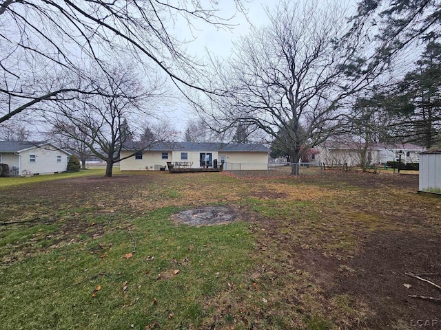 view of yard featuring a wooden deck