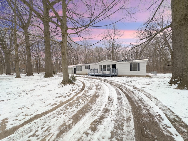 view of front of property with a wooden deck