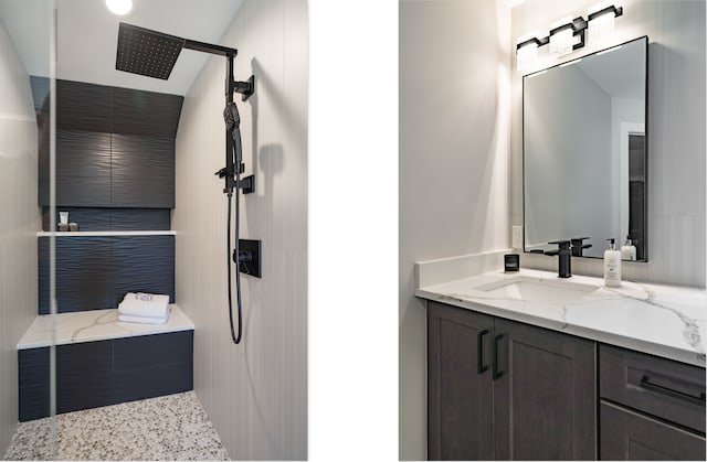 bathroom with vanity and a shower