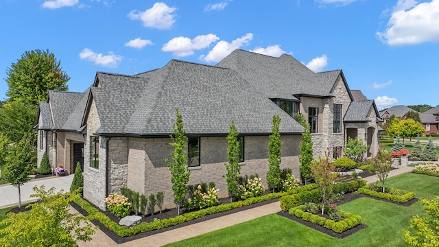 view of side of home featuring a yard