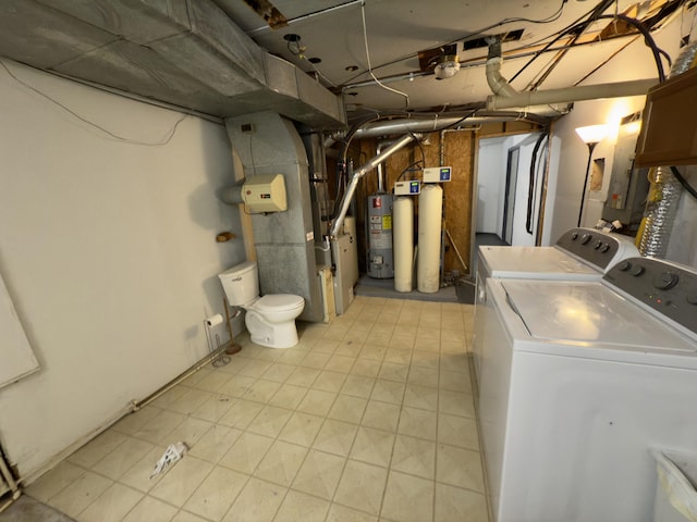 interior space featuring electric panel, washer and dryer, heating unit, and gas water heater