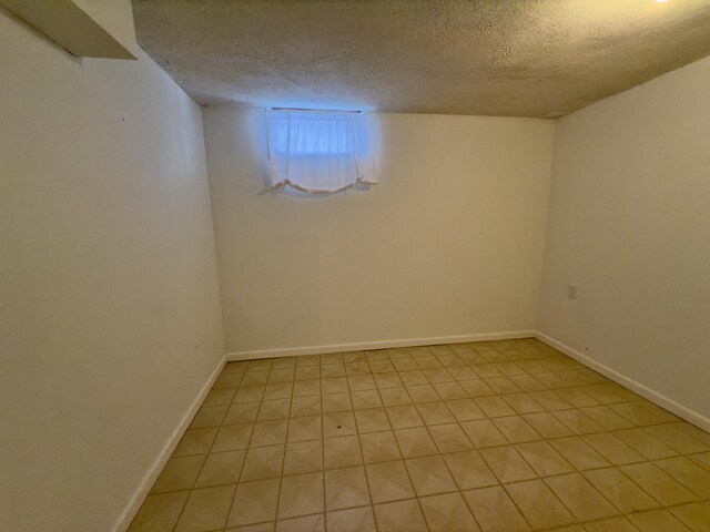 basement with a textured ceiling