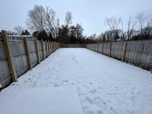 view of yard covered in snow