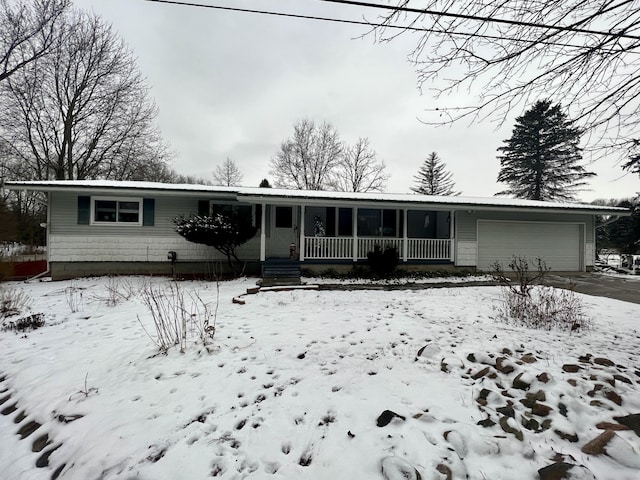 view of front of home with a garage and covered porch