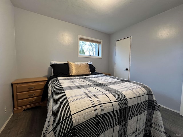 bedroom featuring dark hardwood / wood-style floors