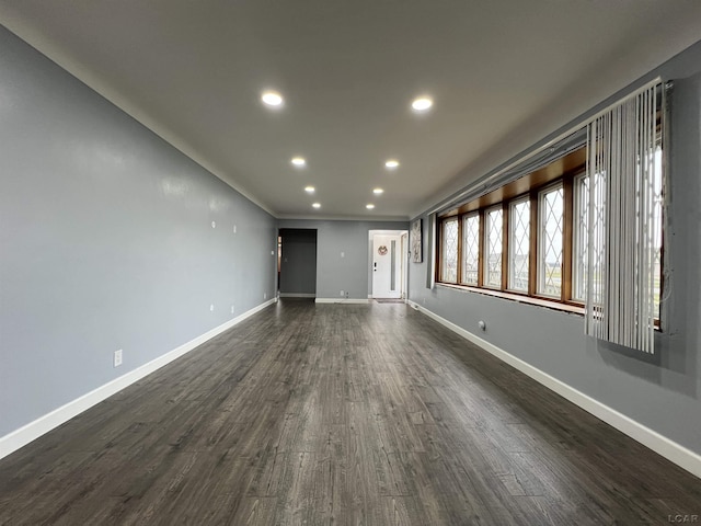 unfurnished living room featuring dark hardwood / wood-style floors