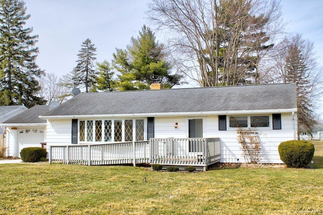 single story home featuring a chimney, a deck, and a front lawn
