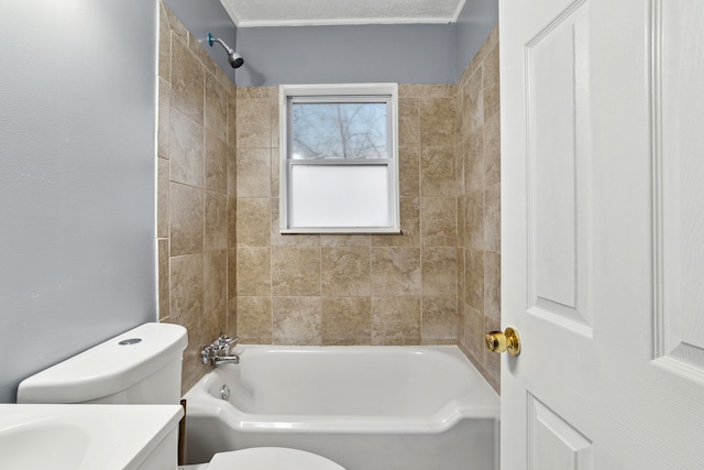 full bathroom with vanity, toilet, and tiled shower / bath