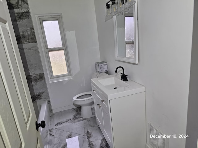 bathroom featuring vanity and toilet