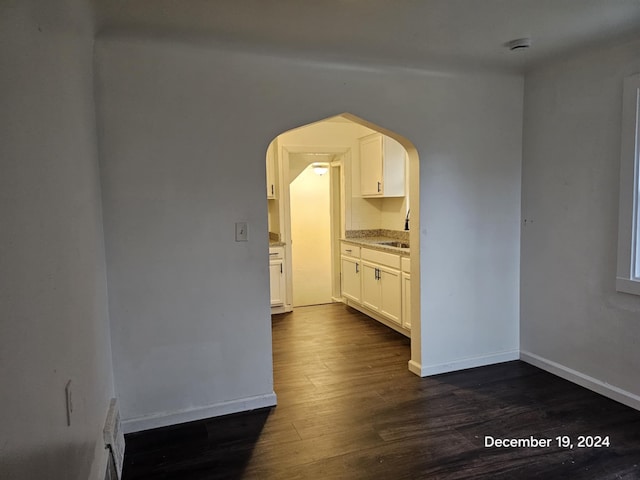 interior space with dark hardwood / wood-style flooring and sink