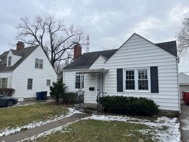 view of front of house with a yard