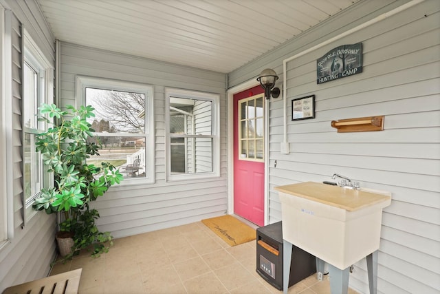 interior space with a porch and sink