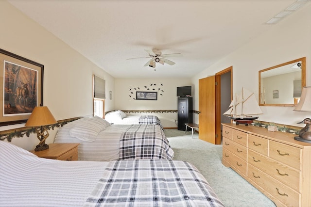 bedroom featuring ceiling fan and light colored carpet