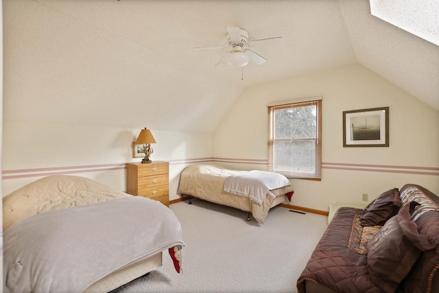 carpeted bedroom with ceiling fan and lofted ceiling