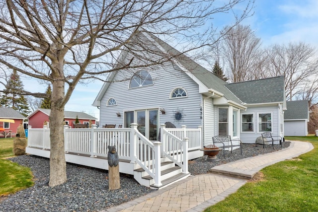 back of house with a wooden deck