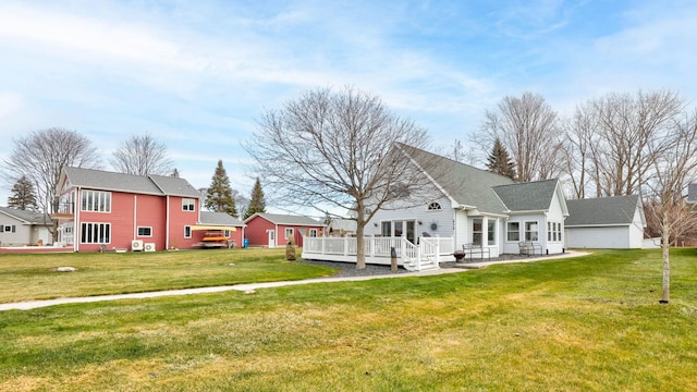 view of front of house featuring a front lawn and a wooden deck