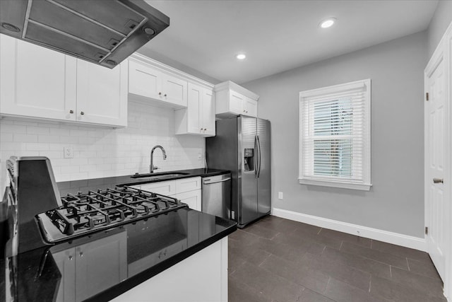 kitchen featuring sink, decorative backsplash, white cabinets, exhaust hood, and appliances with stainless steel finishes