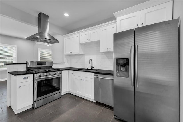 kitchen with white cabinets, wall chimney exhaust hood, and stainless steel appliances