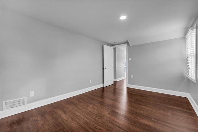 unfurnished bedroom featuring dark hardwood / wood-style flooring