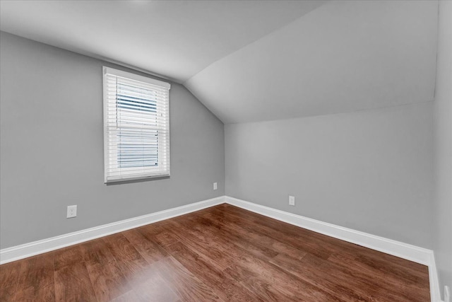 bonus room featuring hardwood / wood-style floors and lofted ceiling