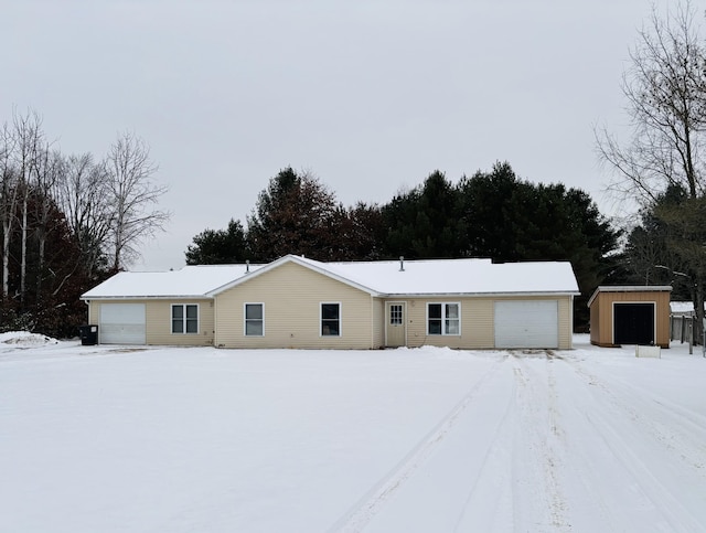 ranch-style house with an outbuilding and a garage