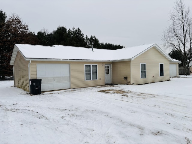 single story home featuring a garage