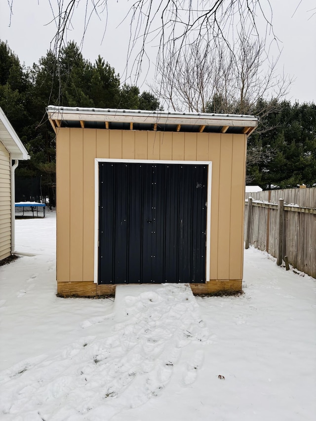 view of snow covered garage