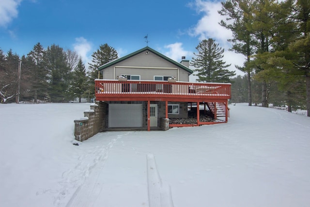 view of front of house with a deck and a garage